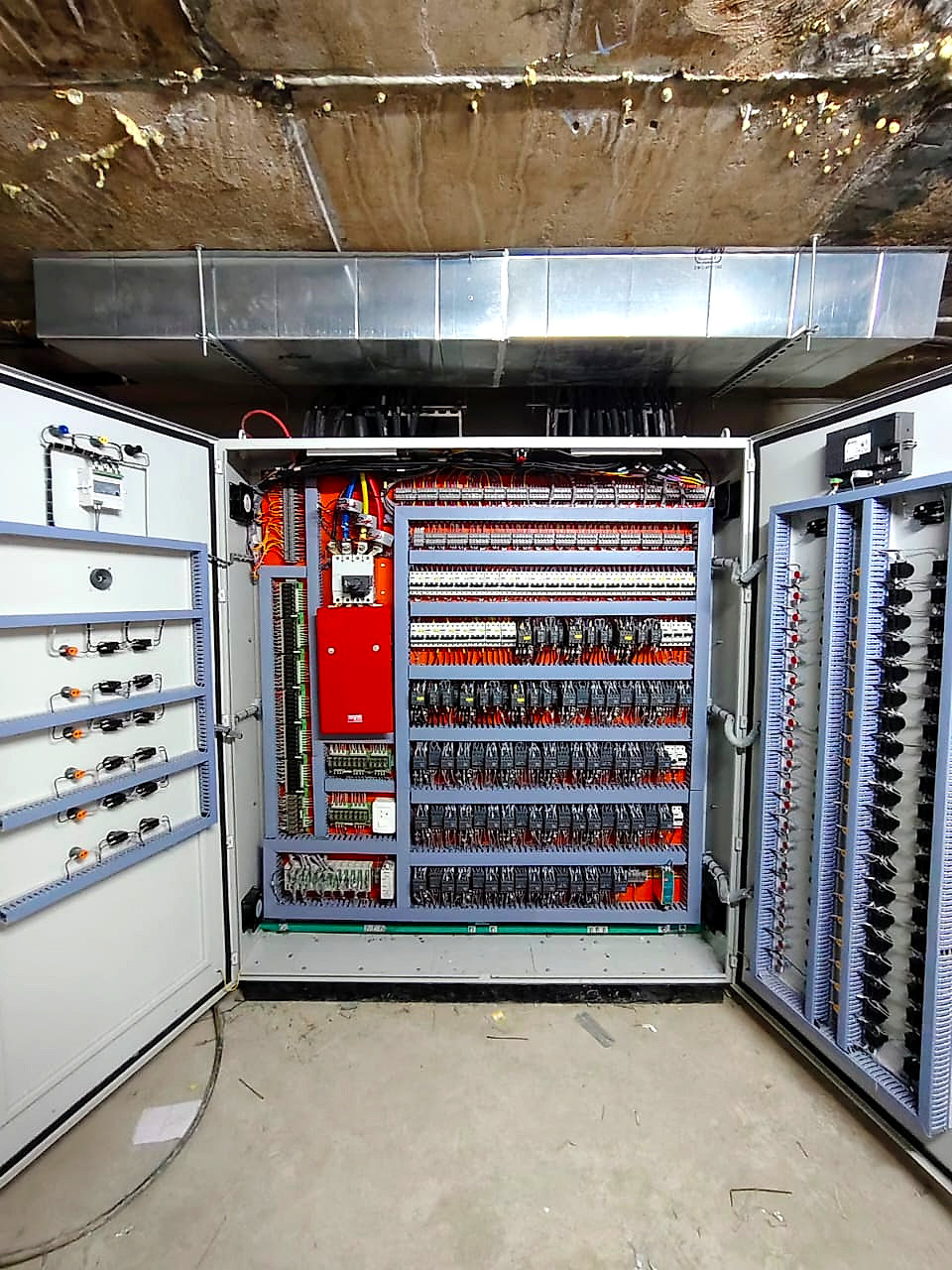 Inside an automation panel built by PowerZone, showing the controller and dressed wiring